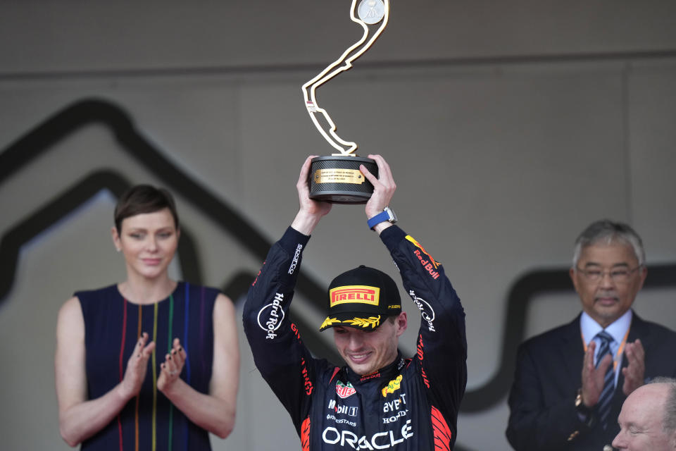 Red Bull driver Max Verstappen of the Netherlands celebrates with his trophy on the podium after winning the Monaco Formula One Grand Prix, at the Monaco racetrack, in Monaco, Sunday, May 28, 2023. (AP Photo/Luca Bruno)