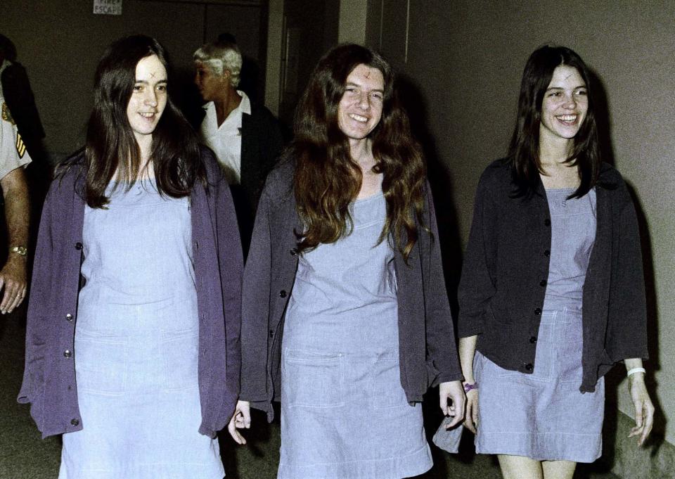 In this Aug. 1970 file photo, Charles Manson followers, from left: Susan Atkins, Patricia Krenwinkel and Leslie Van Houten walk to court to appear for their roles in the 1969 cult killings of seven people, including pregnant actress Sharon Tate, in Los Angeles.