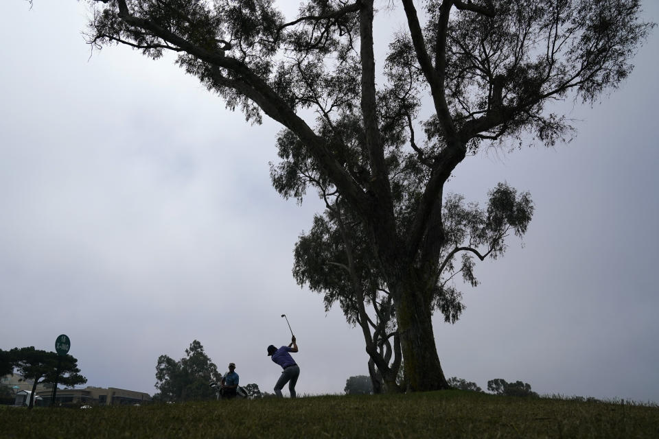 Carlos Ortiz, of Mexico, hits on the fairway of the 18th hole during a practice round of the U.S. Open Golf Championship Monday, June 14, 2021, at Torrey Pines Golf Course in San Diego. (AP Photo/Gregory Bull)