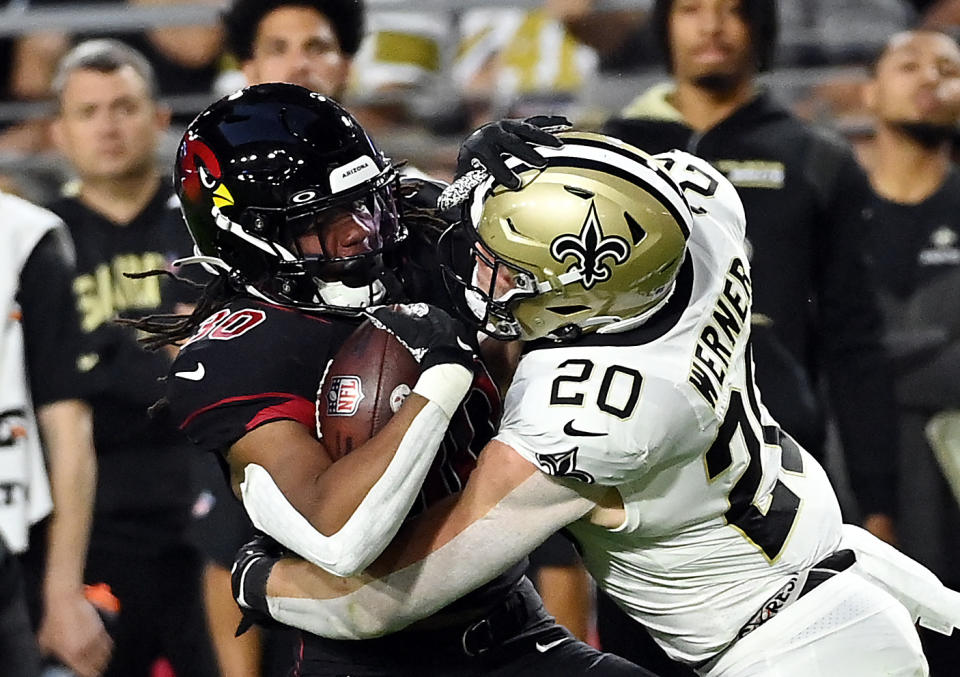 GLENDALE, ARIZONA – OCTOBER 20: Keaontay Ingram #30 of the Arizona Cardinals carries the ball as Pete Werner #20 of the New Orleans Saints tackles during the 1st quarter of the game at State Farm Stadium on October 20, 2022 in Glendale, Arizona. (Photo by Norm Hall/Getty Images)