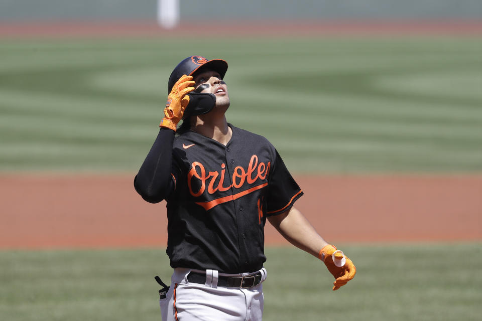 Baltimore Orioles' Rio Ruiz celebrates as he arrives at home plate after hitting a two-run home run off a pitch by Boston Red Sox's Ryan Weber during the first inning of a baseball game, Sunday, July 26, 2020, in Boston. (AP Photo/Steven Senne)