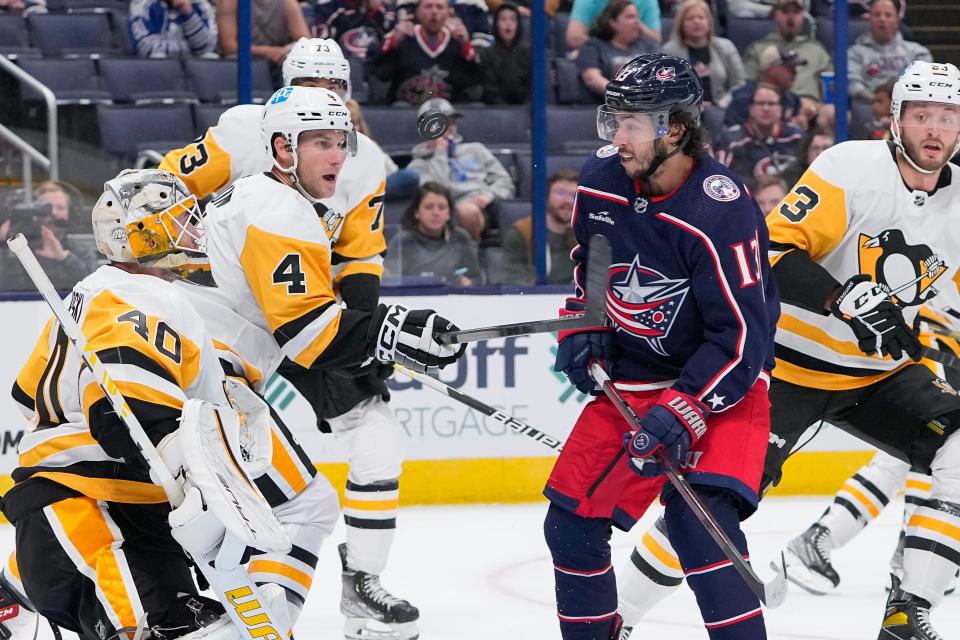 Sep 25, 2022; Columbus, Ohio, USA;  Columbus Blue Jackets left wing Johnny Gaudreau (13) watches a puck float toward Pittsburgh Penguins goaltender Dustin Tokarski (40) during the first period of the preseason NHL hockey game at Nationwide Arena. Mandatory Credit: Adam Cairns-The Columbus Dispatch