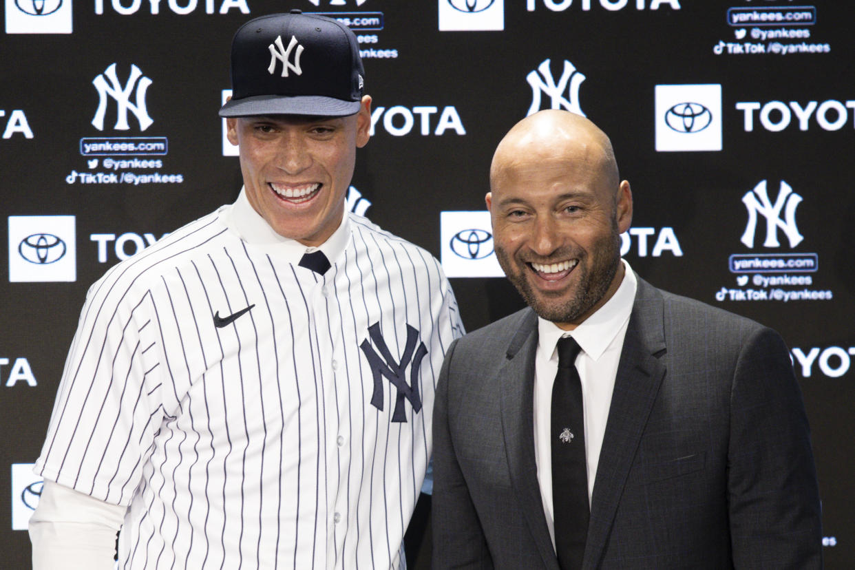 Aaron Judge was greeted by Yankees legend Derek Jeter as he formally re-signed with the famed club in December. (Photo by Dustin Satloff/Getty Images)