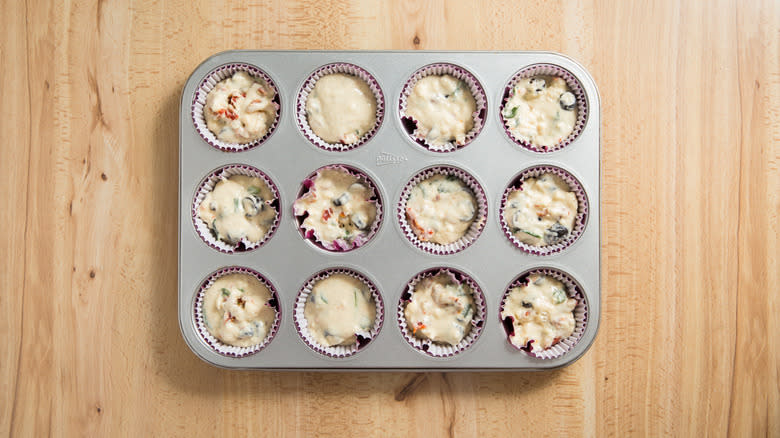 muffin tin filled with batter