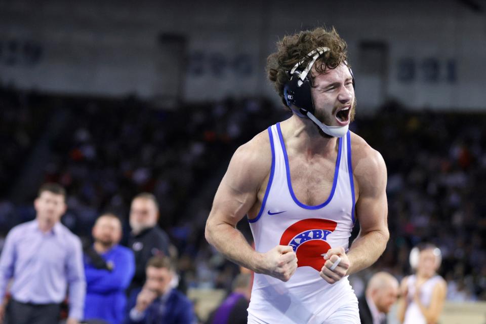 Bixby's Gage Walker celebrates after winning the Class 6A 126-pound championship match at the state tournament Saturday night at State Fair Arena.
