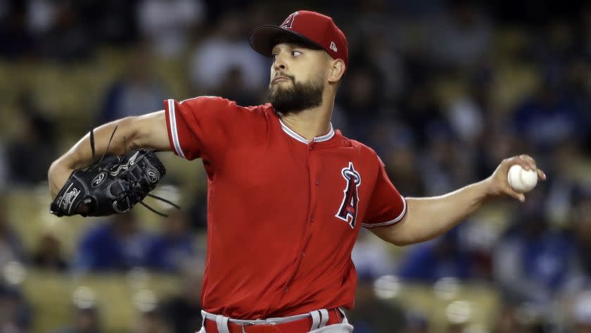 Los Angeles Angels starting pitcher Patrick Sandoval throws to the Los Angeles Dodgers during the first inning of a preseason baseball game Tuesday, March 26, 2019, in Anaheim, Calif. (AP Photo/Marcio Jose Sanchez)