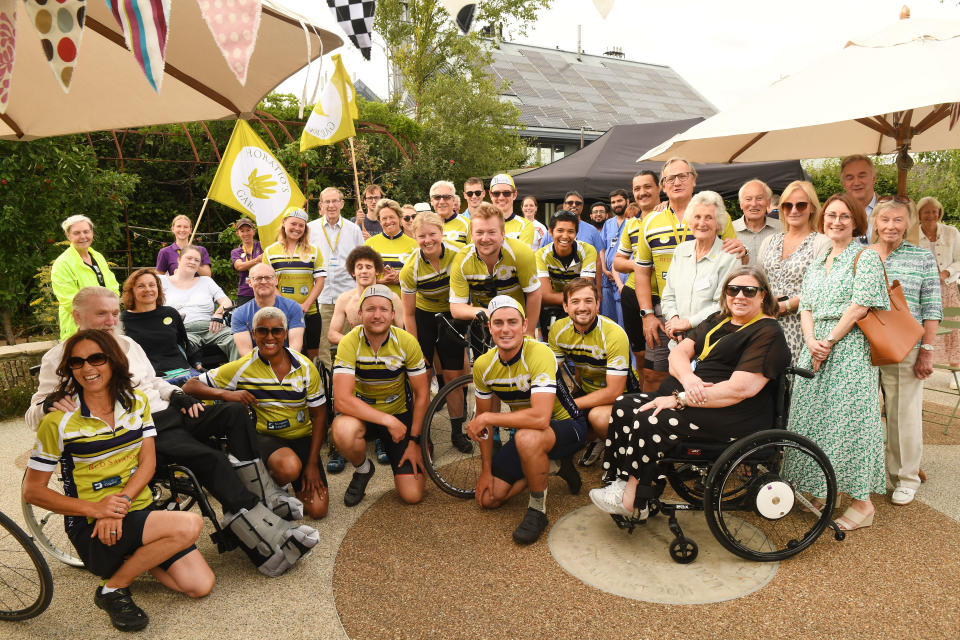 The cycle team met with patients and staff at the spinal injury centres (Russell Sach/PA)