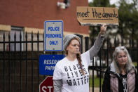 A group of demonstrators protest outside a police precinct in response to the death of Tyre Nichols, who died after being beaten by Memphis police officers, in Memphis, Tenn., Sunday, Jan. 29, 2023. (AP Photo/Gerald Herbert)