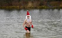 In Germany the Berliner Seehunde (Berlin seals) swimming club held their traditional Christmas bath at the Orankesee lake