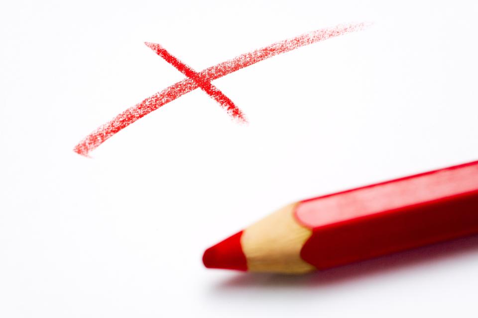 An X written in red pencil
