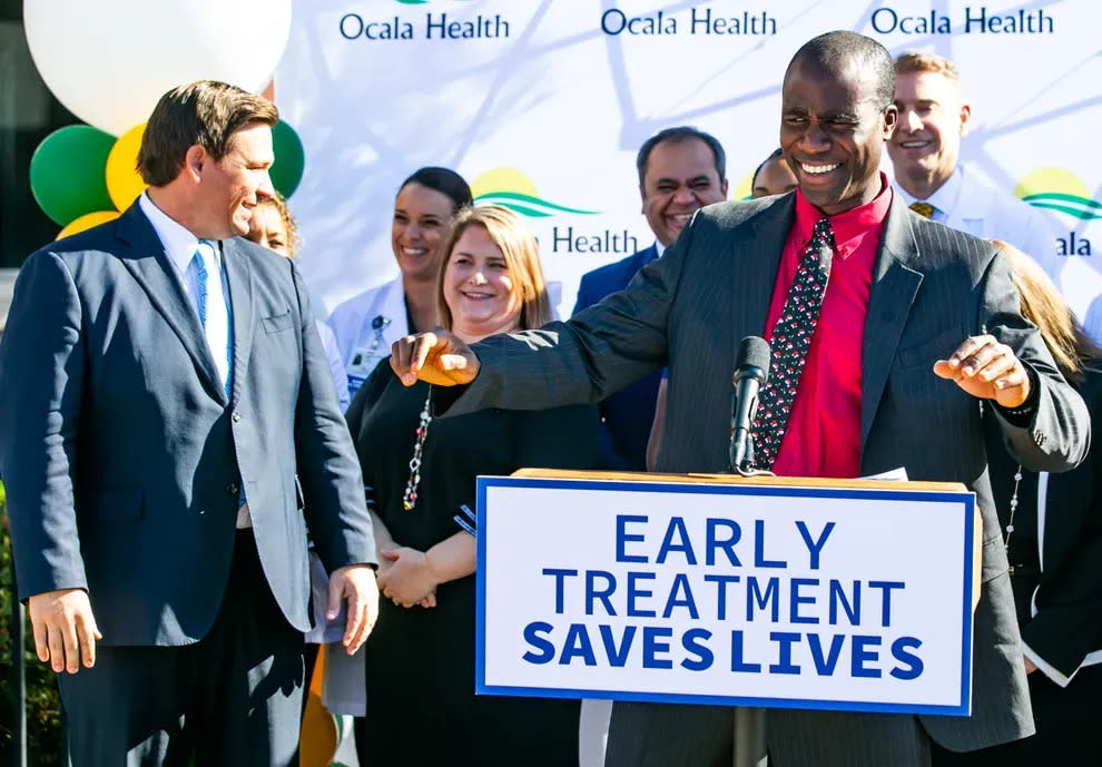 Florida Surgeon General Joseph Ladapo and Gov. Ron DeSantis hold a press conference in Ocala in December 2021. They now advise against getting the new COVID-19 vaccination, just as they did the original.