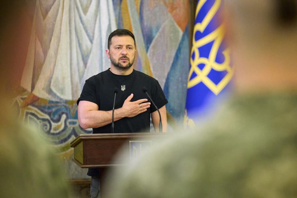 President Volodymyr Zelensky listens to the state anthem during a ceremony on the occasion of the Day of the Signal Forces of Ukraine, 8 August (UKRAINIAN PRESIDENTIAL PRESS SER)