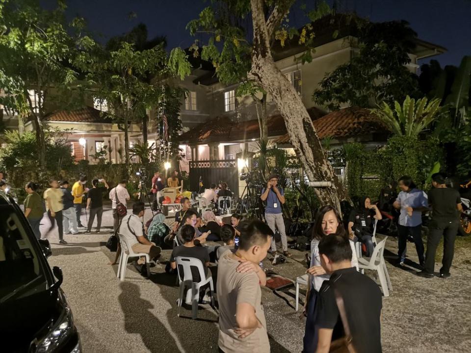 Members of the media gather in front of Tan Sri Muyhiddin Yassin’s house in Bukit Damansara, February 28, 2020. — Picture by Shafwan Zaidon