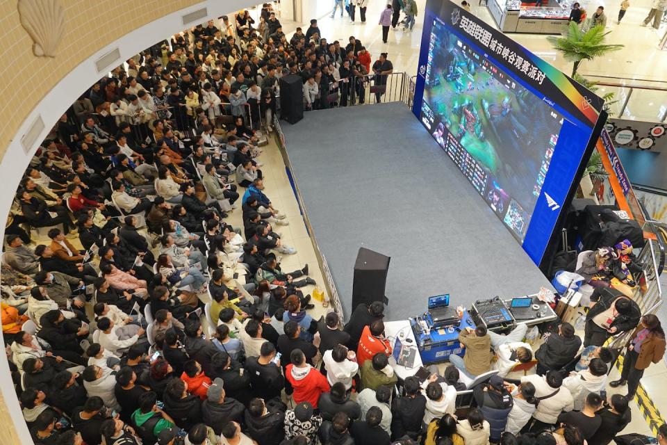 People at Joy City Shopping Complex in Yantai, China, watch a live broadcast of the 2023 League of Legends world championship final on Nov. 19, 2023. League of Legends is a multiplayer online battle arena video game. <a href="https://www.gettyimages.com/detail/news-photo/people-gather-at-joy-city-shopping-complex-to-watch-a-giant-news-photo/1802127612" rel="nofollow noopener" target="_blank" data-ylk="slk:Tang Ke/VCG via Getty Images;elm:context_link;itc:0;sec:content-canvas" class="link ">Tang Ke/VCG via Getty Images</a>