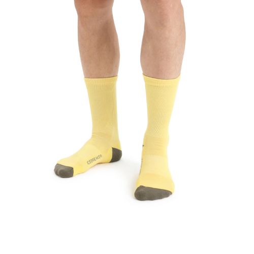 man wearing wool yellow socks by icebreaker