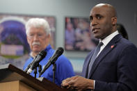 Kansas City Royals owner John Sherman, left, looks on while Kansas City Mayor Quinton Lucas endorses a plan to extend an existing sales tax to provide funding for a new baseball stadium for the Royals and stadium improvements for the Kansas City Chiefs Saturday, March 30, 2024, at Kauffman Stadium in Kansas City, Mo. Jackson County, Mo. residents will vote on the question Tuesday, April 2. (AP Photo/Charlie Riedel)