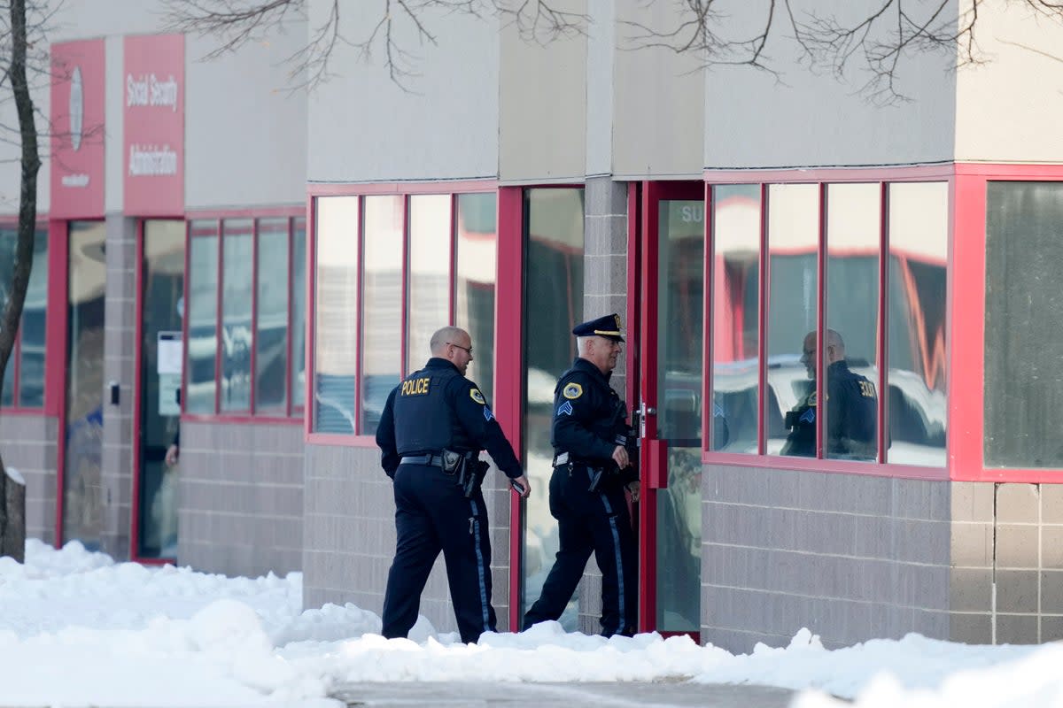 Police enter the Starts Right Here building in Des Moines, Iowa, where two students were killed and a teacher was injured in a shooting  (AP)