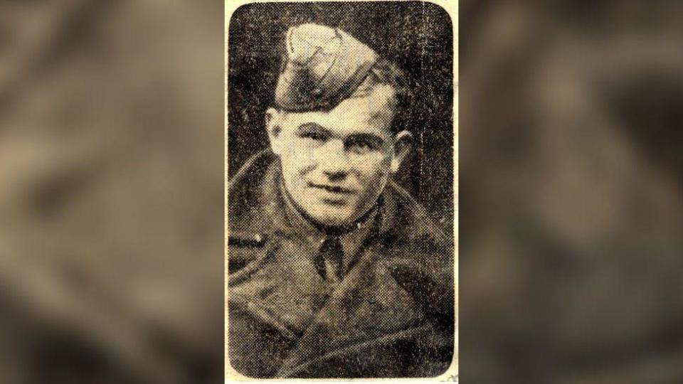 A black and white picture of Pte Wakenshaw in his uniform