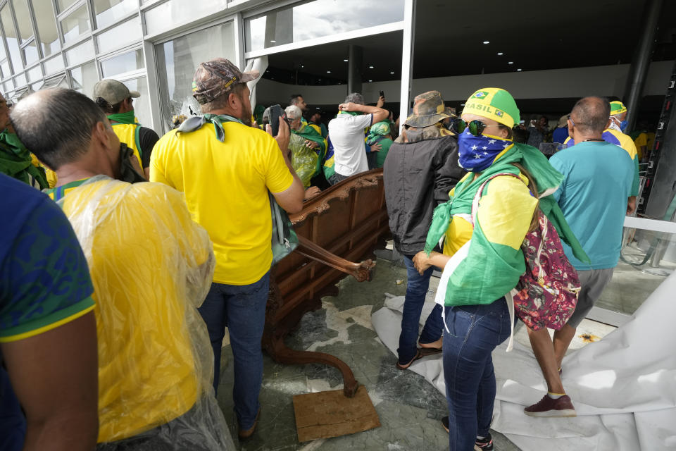 FILE - Protesters, supporters of Brazil's former President Jair Bolsonaro, storm the Planalto Palace in Brasilia, Brazil, Jan. 8, 2023. Planalto is the official workplace of the president of Brazil. (AP Photo/Eraldo Peres, File)