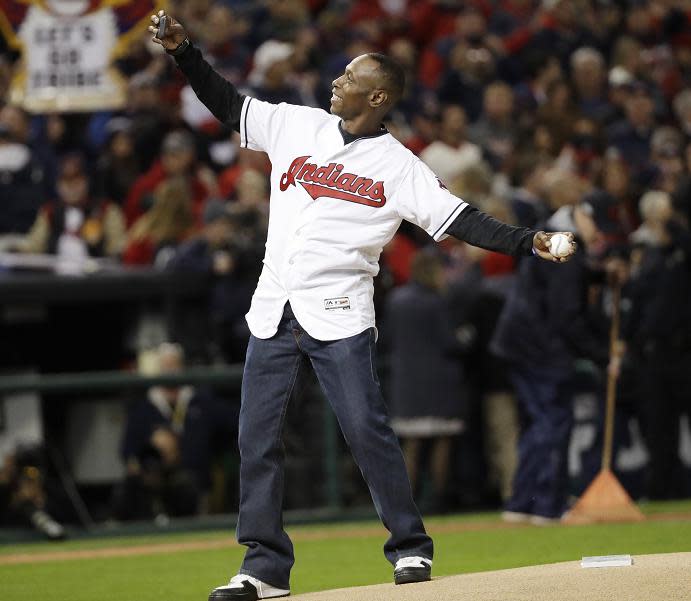 Former Cleveland Indians outfielder Kenny Lofton throws the ceremonial first pitch before Game 1 of the World Series at Progressive Field. (AP)