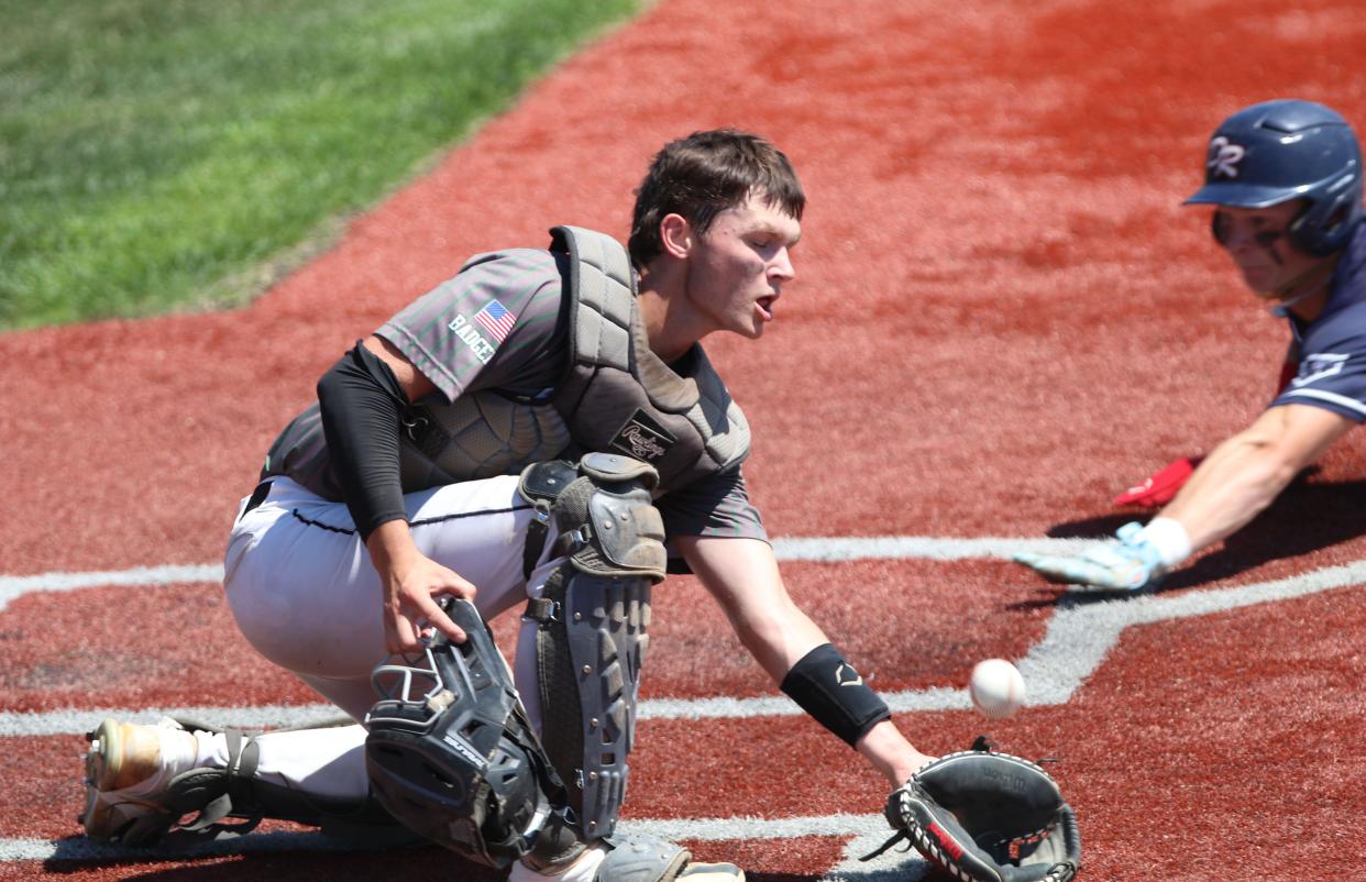 Big Stone City catcher Isaac Brown attempts to field a throw as a Dell Rapids base runner slides into home during their game in the state Class B American Legion Baseball Tournament on Friday, Aug. 2, 2024 in Salem. Dell Rapids won 10-0 in five innings.