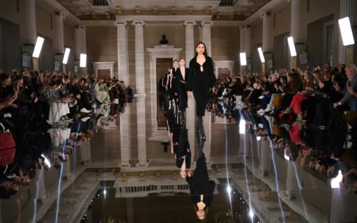 Victoria Beckham, who was supported by her family, said her latest collection, on show at London Fashion Week, said her creations comprise a "gentle rebellion"