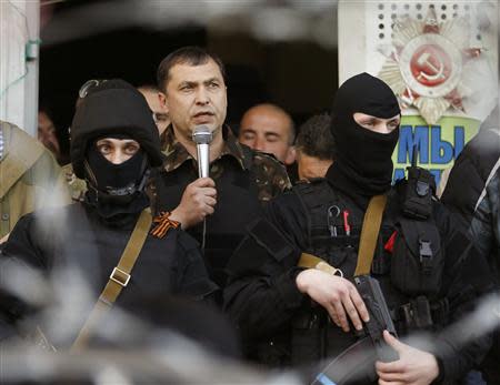 The self-styled mayor of Luhansk region Valery Bolotov speaks during a rally in front of the seized office of the SBU state security service in Luhansk, eastern Ukraine April 25, 2014. REUTERS/Vasily Fedosenko