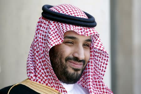 FILE PHOTO - Saudi Arabia's Deputy Crown Prince Mohammed bin Salman reacts upon his arrival at the Elysee Palace in Paris, France, June 24, 2015. REUTERS/Charles Platiau/File Photo