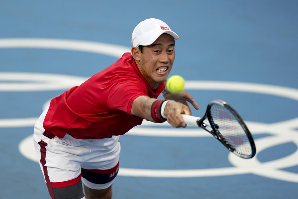 Kei Nishikori, of Japan, returns to Andrey Rublev, of the Russian Olympic Committee, during the tennis competition at the 2020 Summer Olympics, Sunday, July 25, 2021, in Tokyo, Japan. (AP Photo/Patrick Semansky)