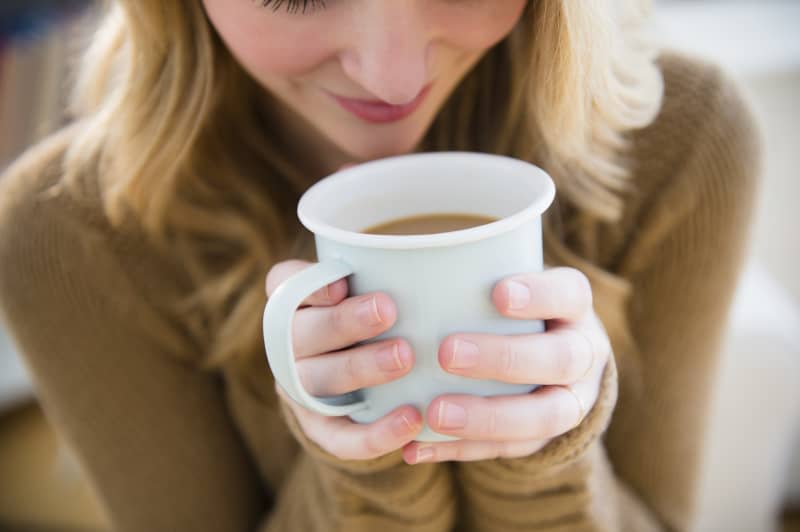 Woman holding coffee mug