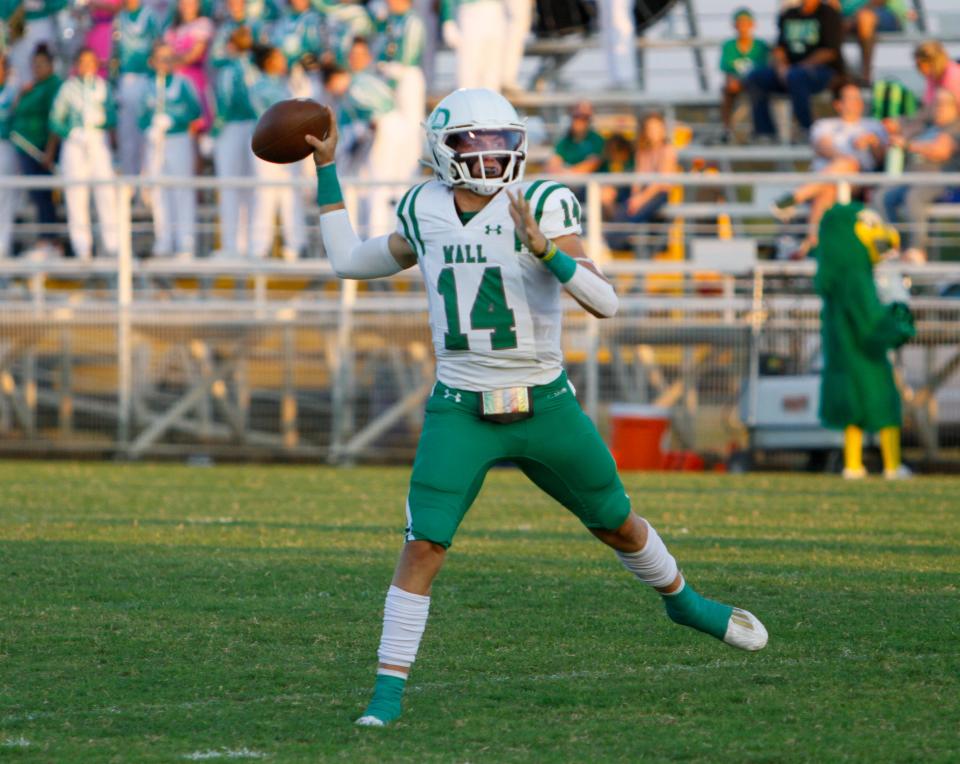 Wall quarterback Gunnar Dillard passes the ball against Mason at R. Clinton Schulze Stadium on Sept. 29, 2023.