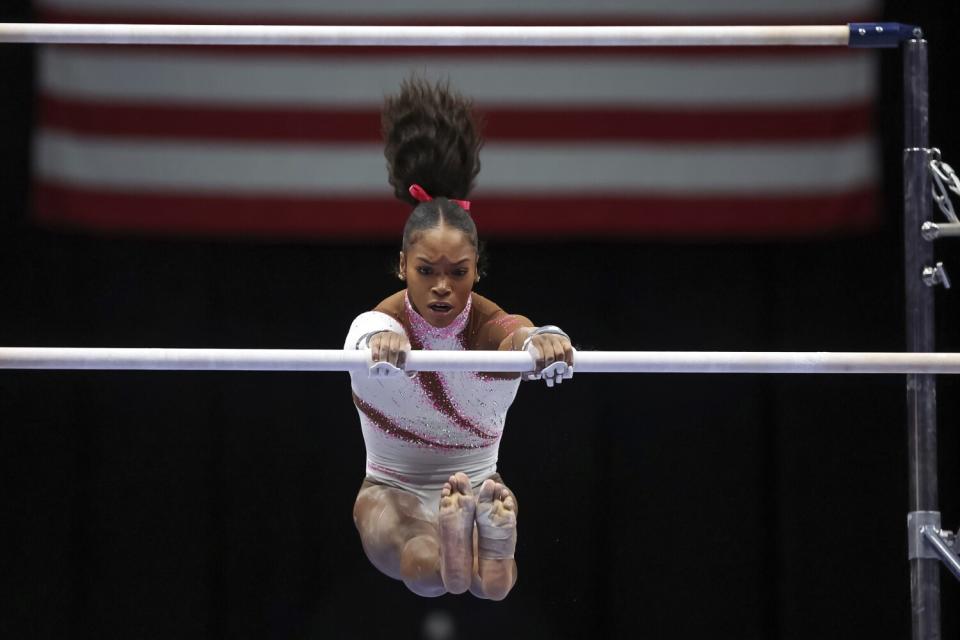 Shilese Jones competes on the uneven bars during the U.S. gymnastics championships Friday.