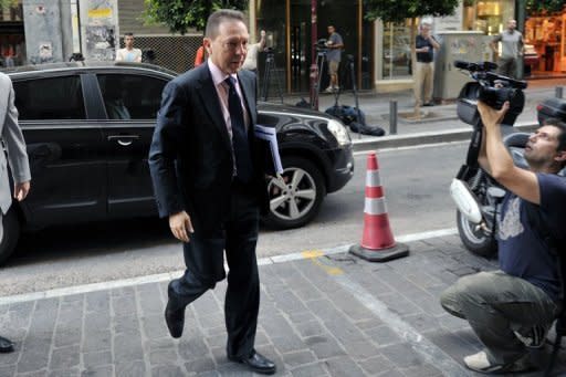 Greek Finance Minister Yannis Stournaras arrives for a meeting at the Finance Ministry in Athens. Greece, which has a multi-billion loan agreement running with the EU, the IMF and the European Central Bank, has been told by its creditors to stick with reforms if it wants to maintain its fund lifeline