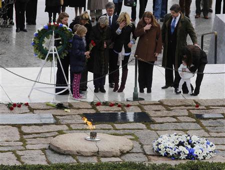 Members of the Kennedy family pay their respects at Arlington National Cemetery to mark the 50th anniversary of the assassination of former U.S. President John F. Kennedy at his gravesite in Arlington, November 22, 2013. REUTERS/Larry Downing