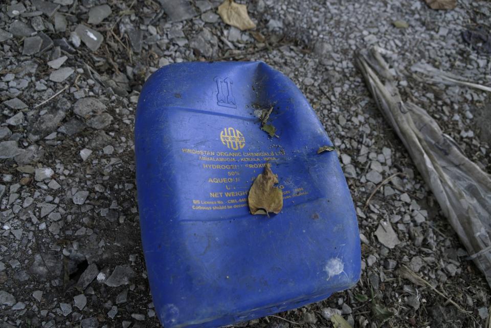 An empty drum from Hindustan Organic Chemicals lies next to the factory on the banks of the Periyar River in Eloor, Kerala state, India, Friday, March 3, 2023. Many of the petrochemical plants here are more than five decades old and produce pesticides, rare earth elements, rubber processing chemicals, fertilizers, zinc-chrome products and leather treatments. Some are government owned, including Fertilisers and Chemicals Travancore, established in 1943, Indian Rare Earths Limited, and Hindustan Insecticides Limited. (AP Photo)