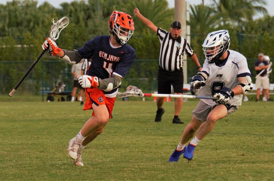 Benjamin's Sean Sheehan is pressured by St. Edward's Josh Langsam during the District 8-1A lacrosse championship game on Thursday, Apr. 14, 2022 in Vero Beach. The Bucs won 16-6.