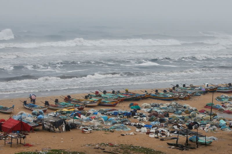 Boats are seen parked on deserted Marina beach during rains before Cyclone Nivar's landfall, in Chennai