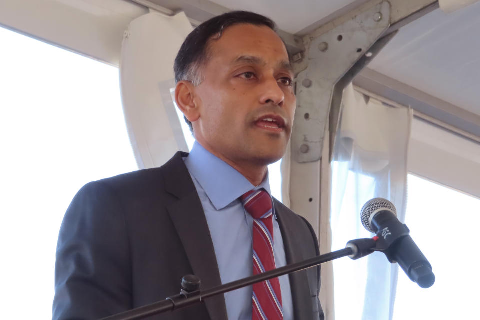 Himanshu Saxena, CEO of Starwood Energy Group, speaks at a news conference in Logan Township N.J. on Friday, Dec. 2, 2022, moments before the company imploded a former coal-burning power plant to make way for a battery facility to store energy from clean sources such as wind and solar power. (AP Photo/Wayne Parry)