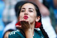 <p>A Mexico fan blows a kiss before the Russia 2018 World Cup round of 16 football match between Brazil and Mexico at the Samara Arena in Samara on July 2, 2018. (Photo by BENJAMIN CREMEL / AFP) </p>