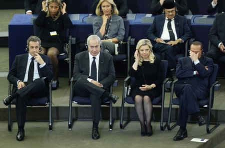 Former French President Nicolas Sarkozy, Israeli Prime Minister Benjamin Netanyahu and his wife Sara and former Italian Prime Minister Silvio Berlusconi attend a memorial ceremony in honour of late former German Chancellor Helmut Kohl, at the European Parliament in Strasbourg, France, July 1, 2017. REUTERS/Francois Lenoir