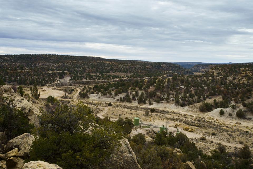 A Hilcorp natural gas location sits in the middle of a canyon on Don Schrieber's ranch,  in the San Juan Basin. Schrieber, a rancher turned activist it the  San Juan Basin, has pushed for more consolidation and upkeep on the wells by the operating companies.