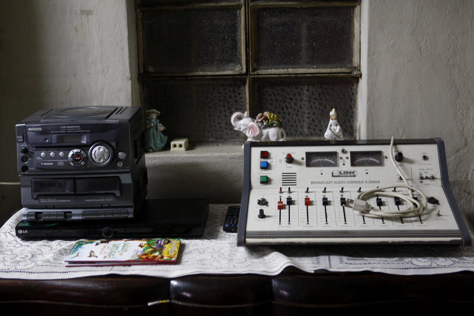 In this Nov. 26, 2012 photo, a compact stereo system and a soundboard sit in the home of journalist and radio host Maria Julia Venegas, better known as Maruja Venegas, 97, in Lima, Peru. Venegas who began broadcasting “Radio Club Infantil,” a show for Peru's children in the golden age of radio and World War II, has earned a citation from Guinness World Records as the globe's longest-running radio personality. (AP Photo/Karel Navarro)