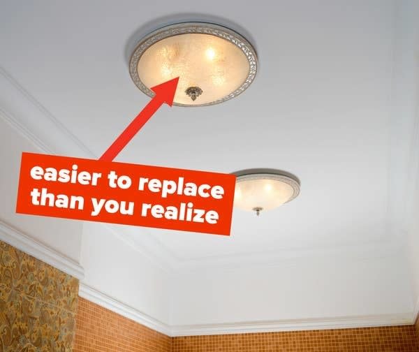 light fixtures that look like boobs with text saying its easier to replace