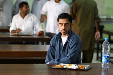 An Asian worker has his lunch at his accommodation in Qadisiya labour camp, Saudi Arabia August 17, 2016. Picture taken August 17, 2016. REUTERS/Faisal Al Nasser