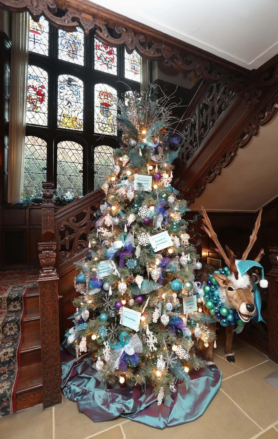 A tree decorated to the theme of the movie "Frozen" is on display at the Grand Staircase inside the Manor House.