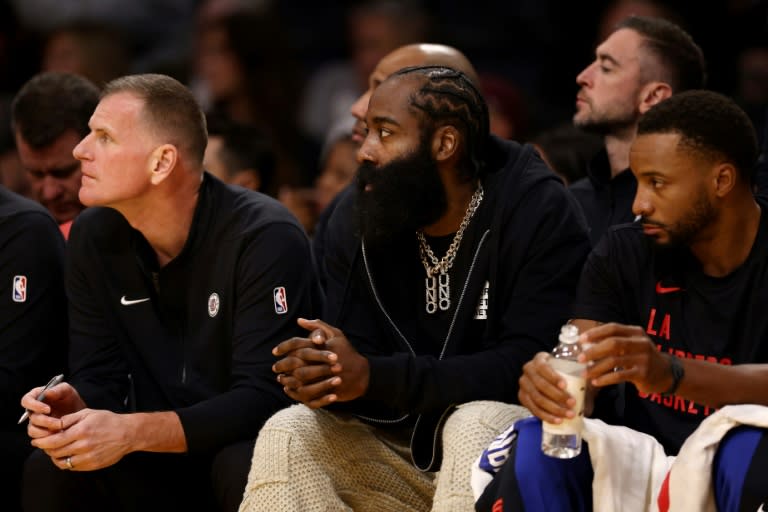 James Harden, middle, watches from the Los Angeles Clippers bench as his club loses to the Los Angeles Lakers, but the newest member of the Clippers' roster says he plans to make his debut for the club on Monday at New York (Katelyn Mulcahy)