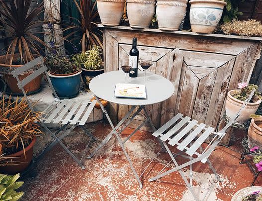 Enjoy al fresco date nights sat at this chic metal bistro set