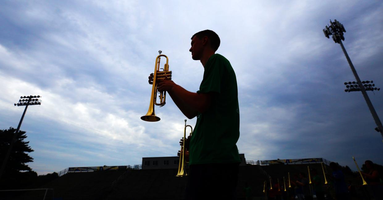 Gahanna Lincoln High School senior and trumpet section leader Ray Ryzenga goes through drills during Golden Lions Marching Band practice July 26.