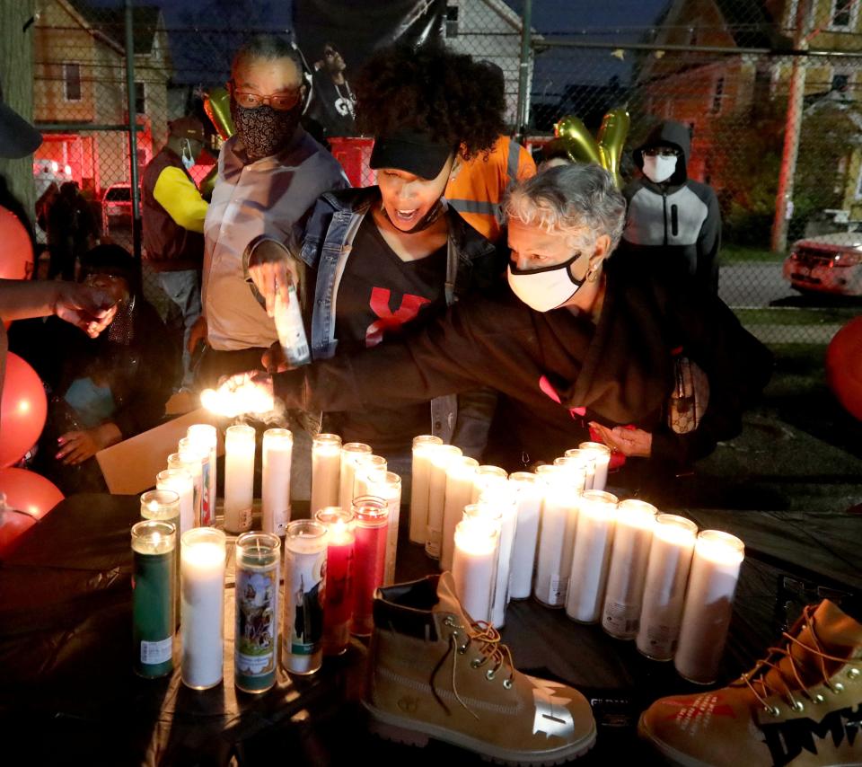 Candles are lit during a celebration of the life of Earl Simmons, the rapper know as DMX at the Fourth St. Park in Mount Vernon, N.Y., April 14, 2021. Hundreds attended the celebration for DMX, who was born in Mount Vernon. The rapper died on April 9 at the age of 50 after suffering a heart attack. 