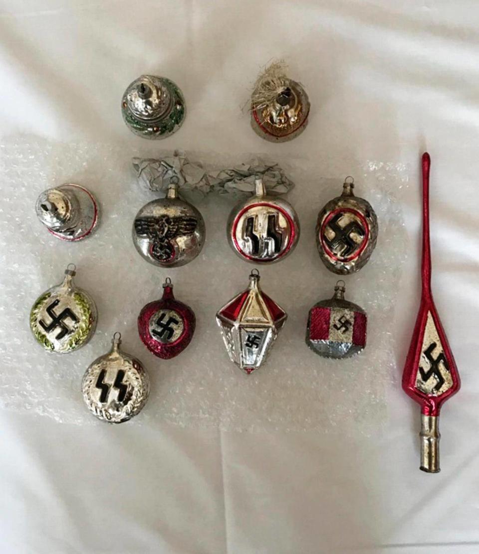 In this undated photo Christmas baubles bearing Nazi insignia are displayed (AP)